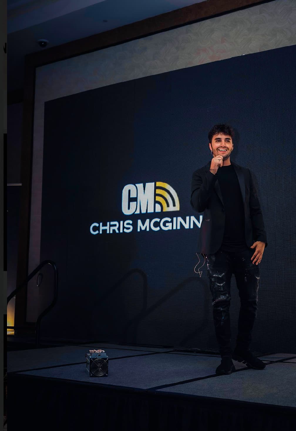 Christopher McGinnis speaking on stage